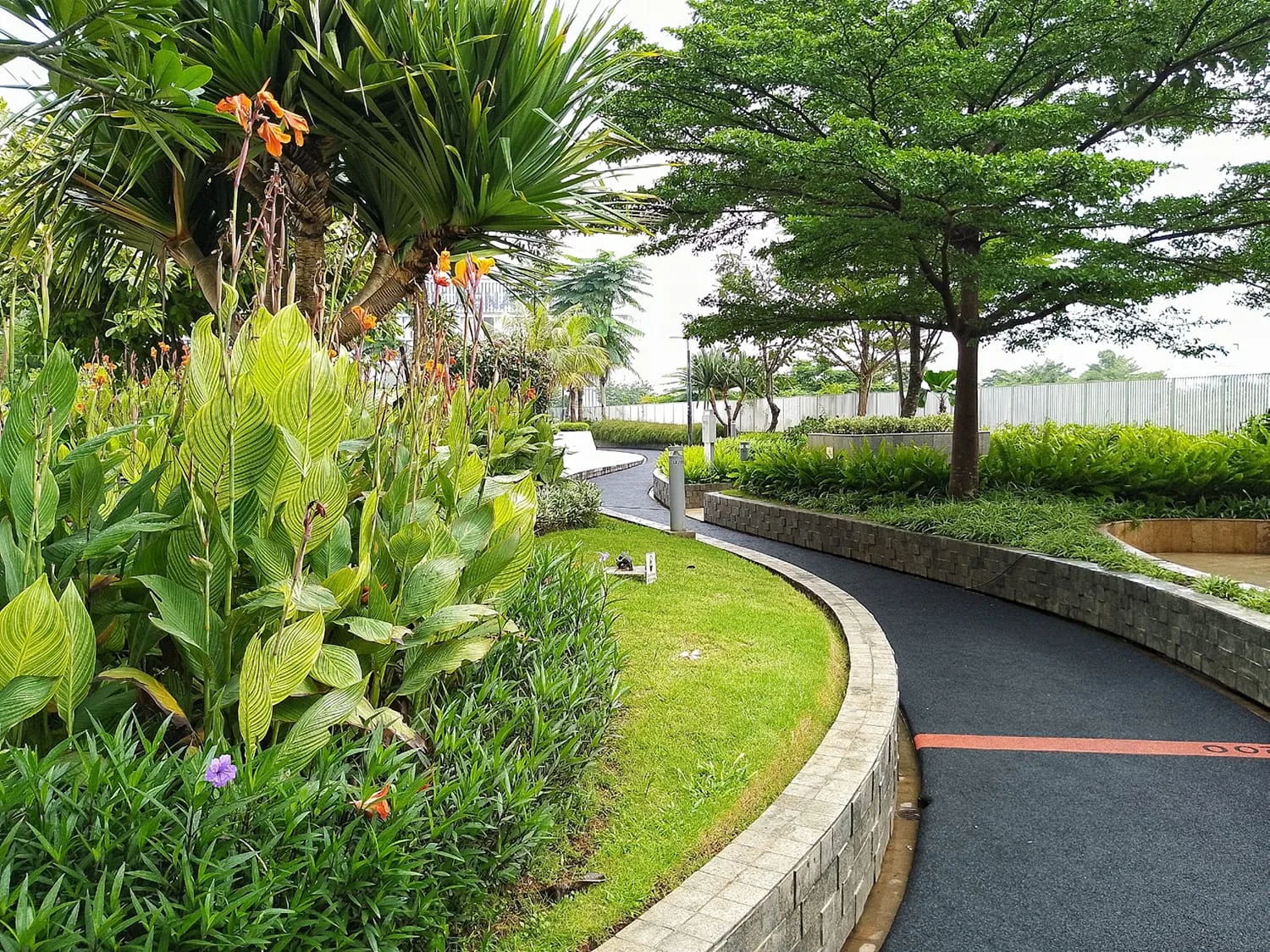 Representative photo of a landscaped garden and jogging track, as listed for Shriram Codename Pudhiya Chennai