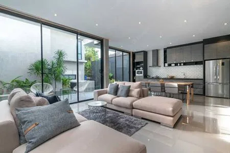 Representative image of an open living room and kitchen, similar to Sobha Wisteria 4 BHK homes on OMR