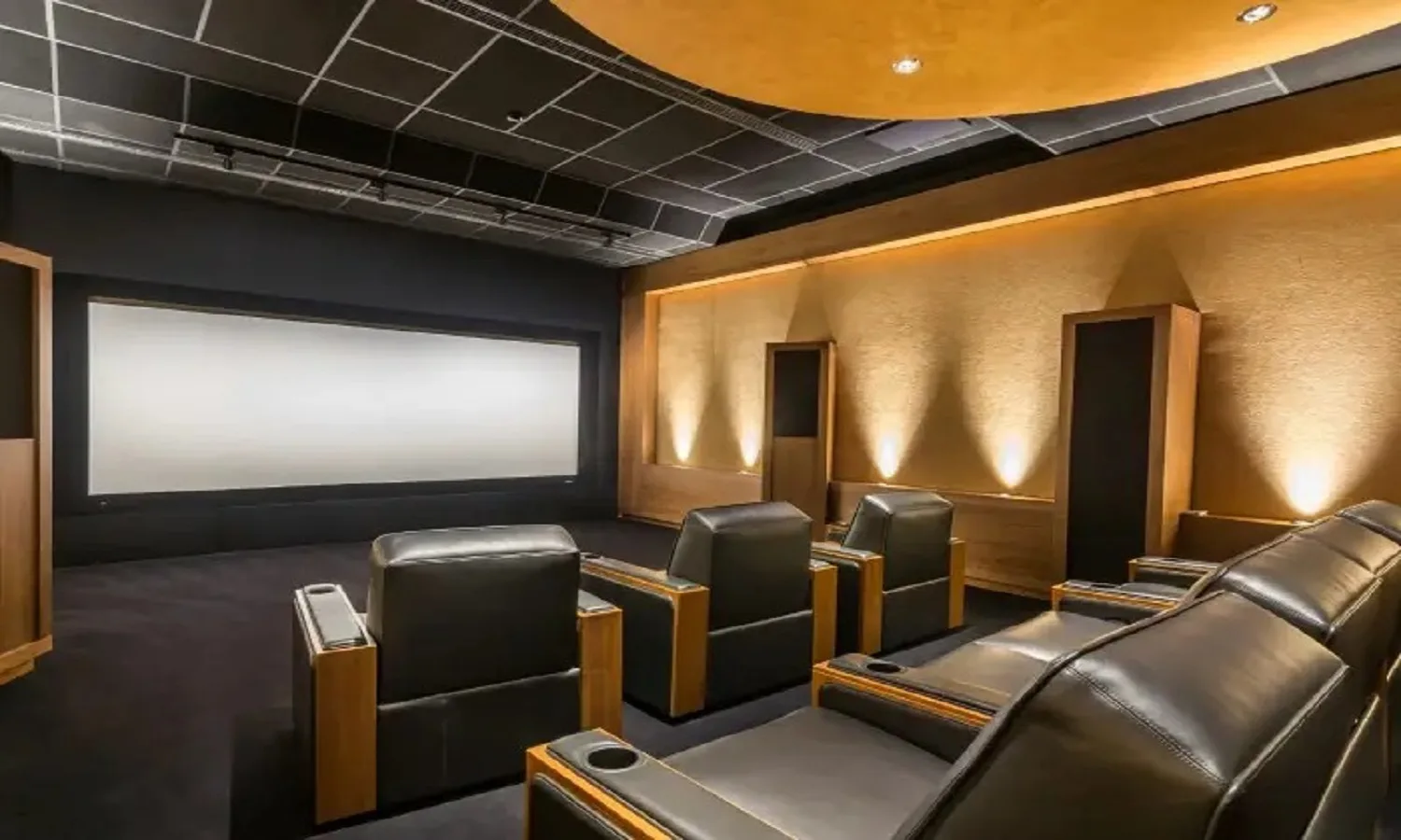 Representative image of a private residents' mini theatre with recliner seating, as listed for Sobha Wisteria Egattur