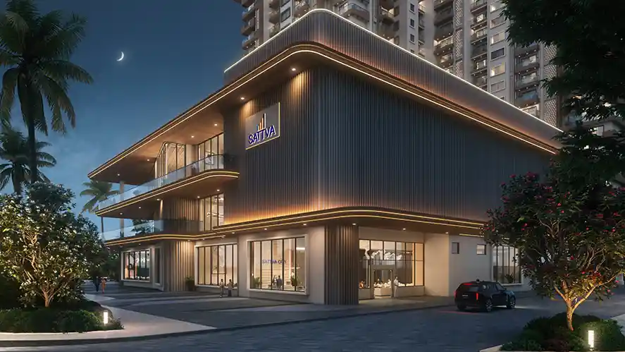 Sattva City retail and clubhouse building at dusk